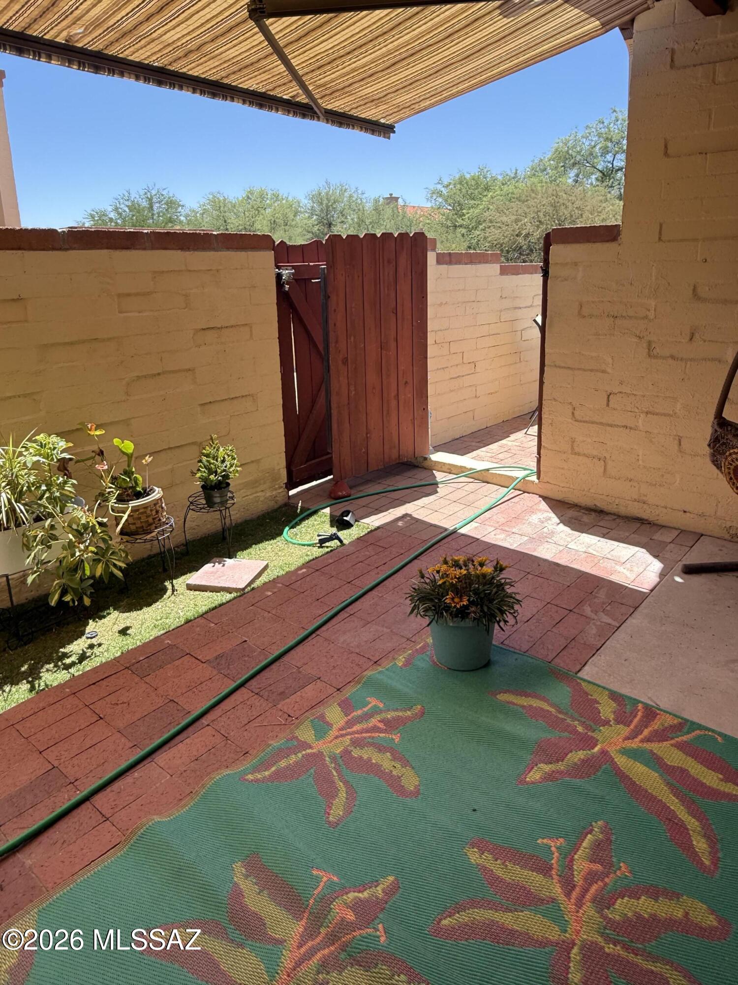 8110 East Rivenoak Circle Tucson, AZ 85715 - Photo 23 of 29 a backyard of a house with table and chairs