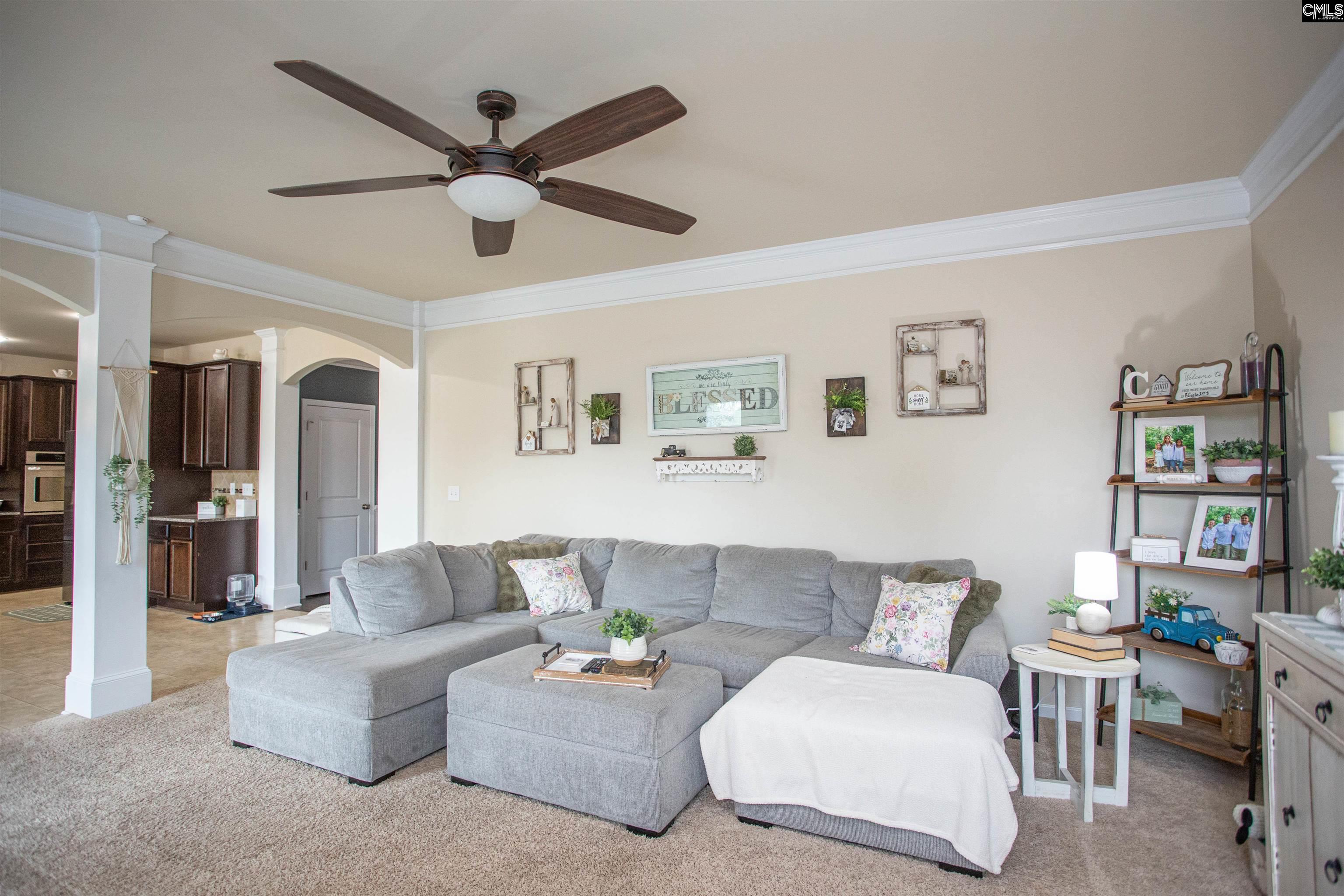 7 Templand Court Elgin, SC 29045 - Photo 18 of 47 a living room with furniture and a ceiling fan