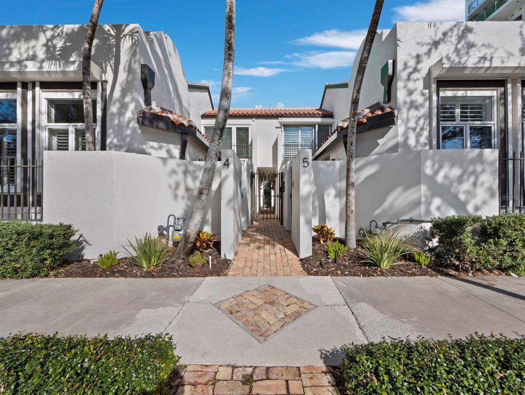 a view of a house with a flower garden
