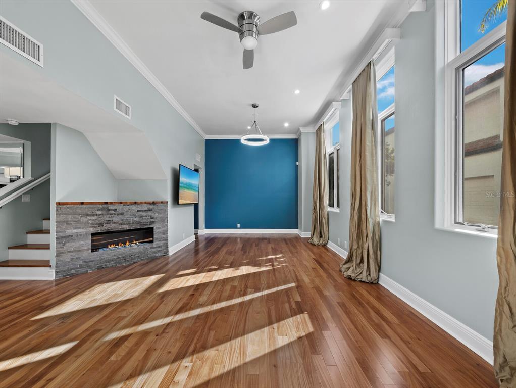 200 Cocoanut Avenue, Unit 7 Sarasota, FL 34236 - Photo 13 of 63 a spacious bedroom with a bed and a fireplace