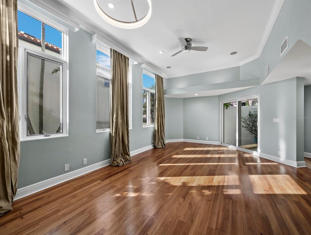 200 Cocoanut Avenue, Unit 7 Sarasota, FL 34236 - Photo 15 of 63 a view of a room with wooden floor and staircase