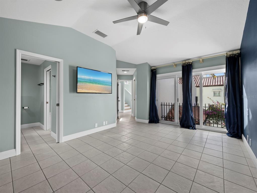 200 Cocoanut Avenue, Unit 7 Sarasota, FL 34236 - Photo 30 of 63 a view of a livingroom with a chandelier fan and windows