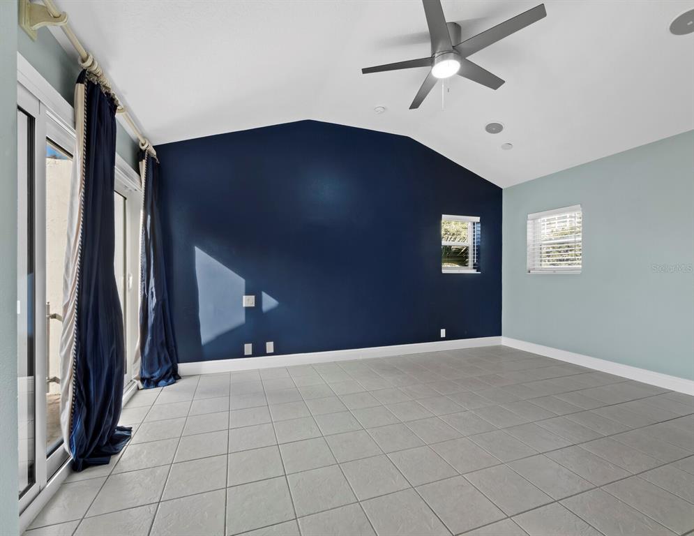 200 Cocoanut Avenue, Unit 7 Sarasota, FL 34236 - Photo 31 of 63 a view of an empty room with a chandelier fan