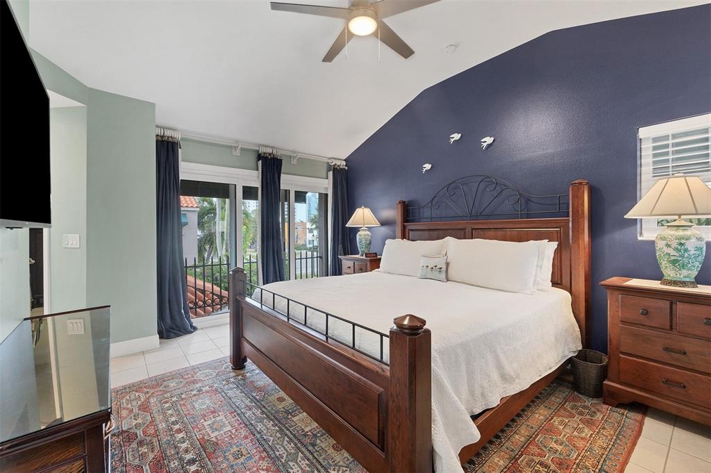 200 Cocoanut Avenue, Unit 7 Sarasota, FL 34236 - Photo 34 of 63 a large bed sitting in a bedroom next to a window