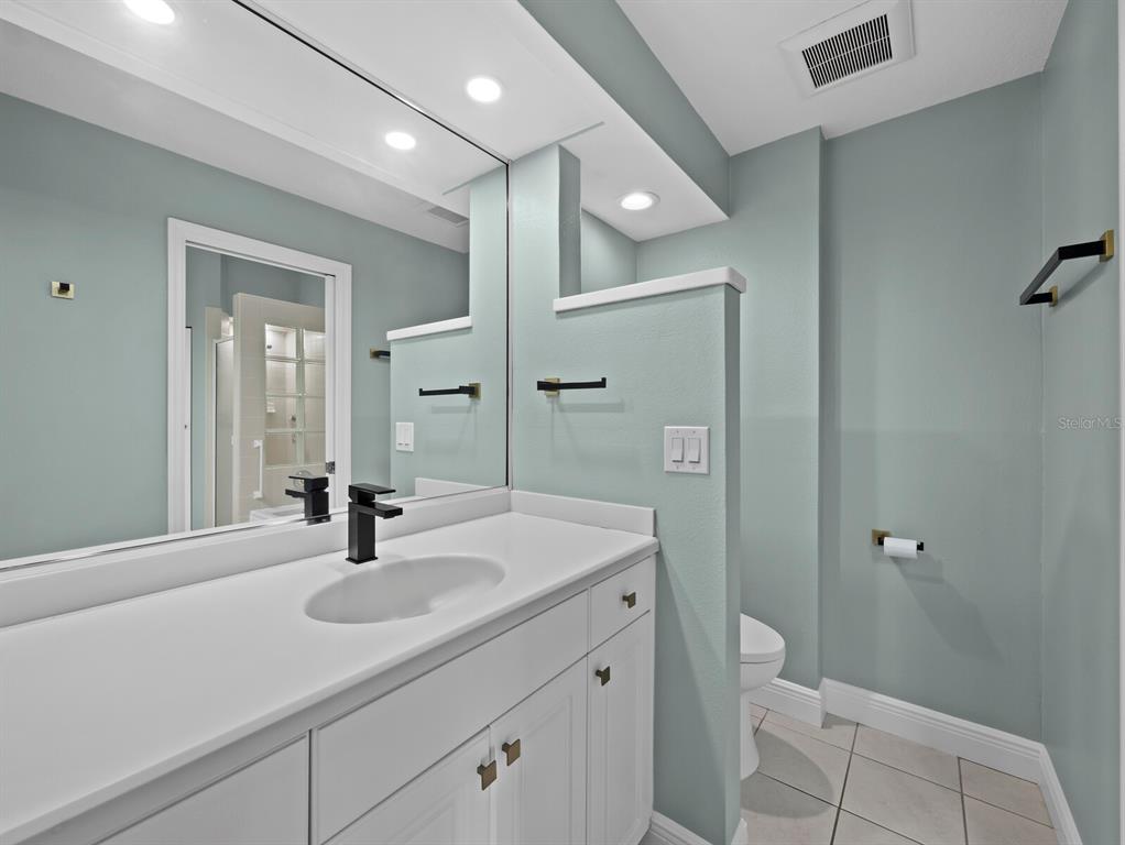 200 Cocoanut Avenue, Unit 7 Sarasota, FL 34236 - Photo 37 of 63 a bathroom with a sink a toilet and shower