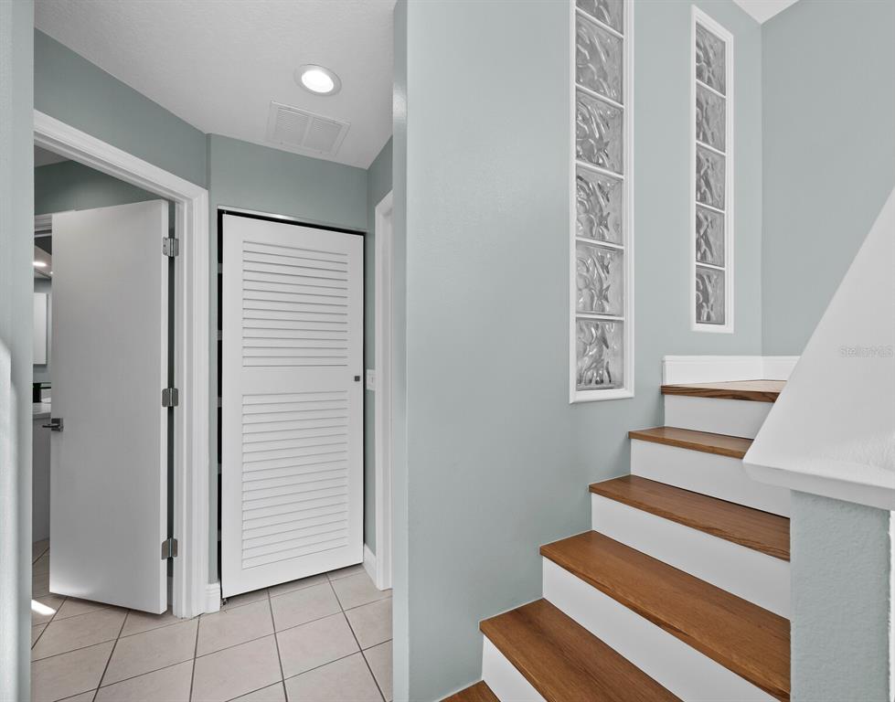 200 Cocoanut Avenue, Unit 7 Sarasota, FL 34236 - Photo 40 of 63 a view of entryway with wooden floor and stairs