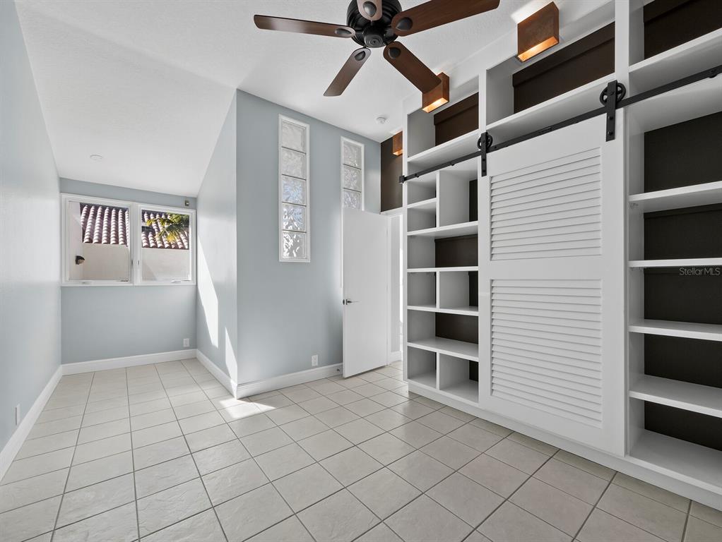200 Cocoanut Avenue, Unit 7 Sarasota, FL 34236 - Photo 44 of 63 a view of walk in closet with empty racks