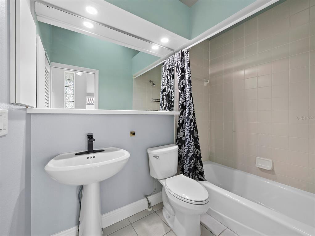 200 Cocoanut Avenue, Unit 7 Sarasota, FL 34236 - Photo 45 of 63 a bathroom with a sink toilet and shower