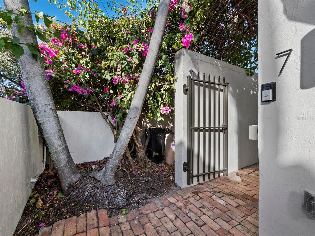 200 Cocoanut Avenue, Unit 7 Sarasota, FL 34236 - Photo 6 of 63 a view of a porch with a table and chair