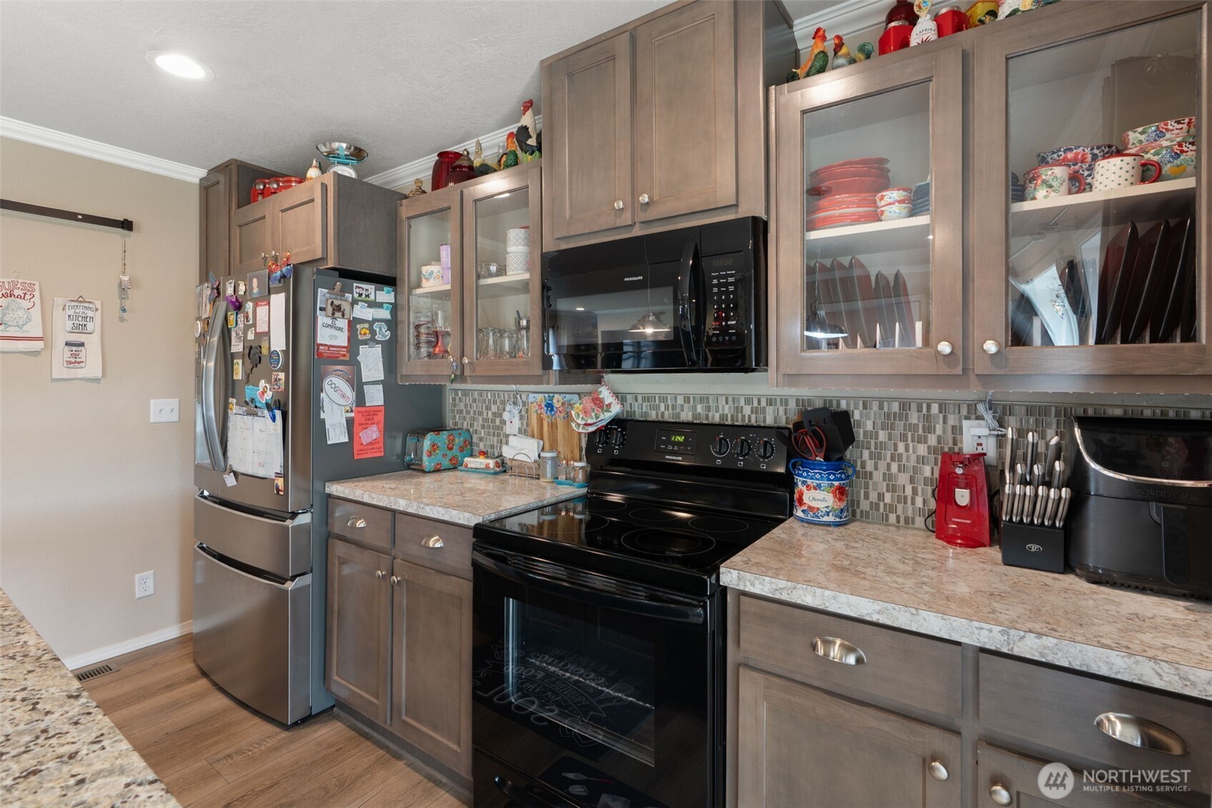 608 Main Street Vader, WA 98593 - Photo 12 of 37 a kitchen with stainless steel appliances granite countertop a stove and a refrigerator
