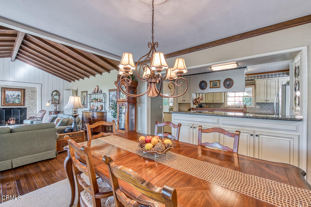 3320 Calvert Road Pasadena, CA 91107 - Photo 11 of 27 a view of a dining room with furniture and a chandelier