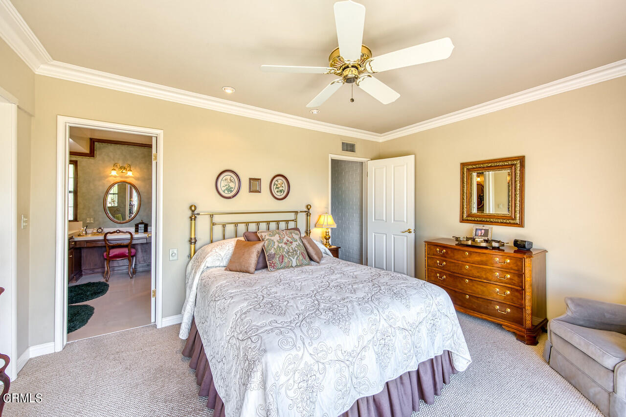 3320 Calvert Road Pasadena, CA 91107 - Photo 20 of 27 a bedroom with a bed and a chandelier