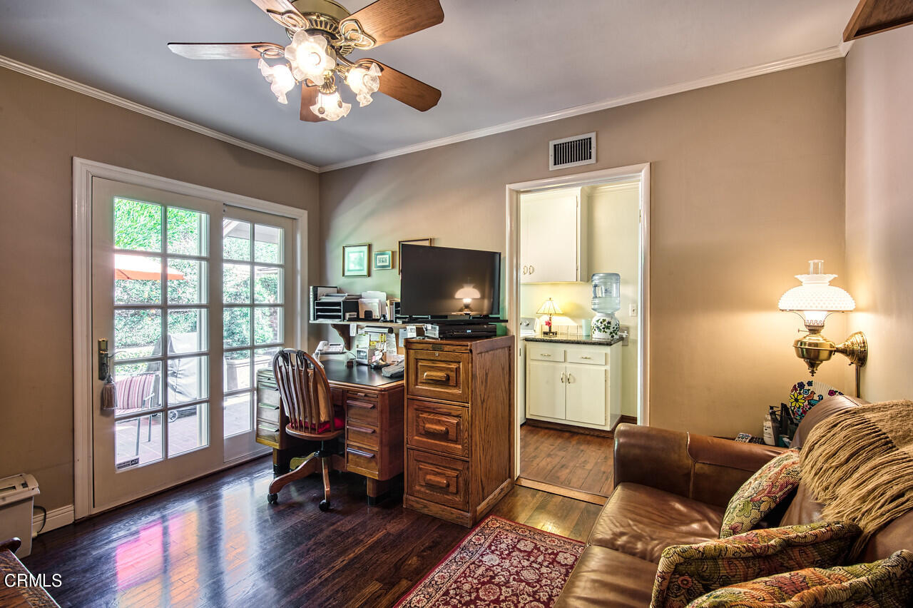 3320 Calvert Road Pasadena, CA 91107 - Photo 23 of 27 a living room with furniture and a flat screen tv