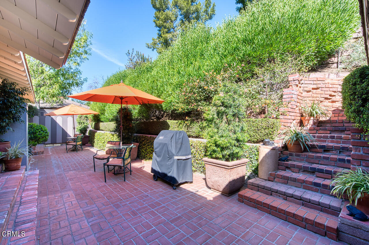 3320 Calvert Road Pasadena, CA 91107 - Photo 24 of 27 a view of a patio with chairs and a potted plant