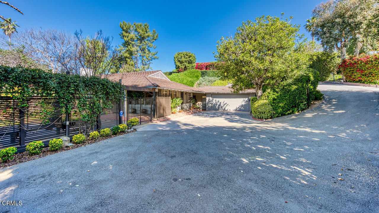 3320 Calvert Road Pasadena, CA 91107 - Photo 3 of 27 a view of a house with a yard and a garden