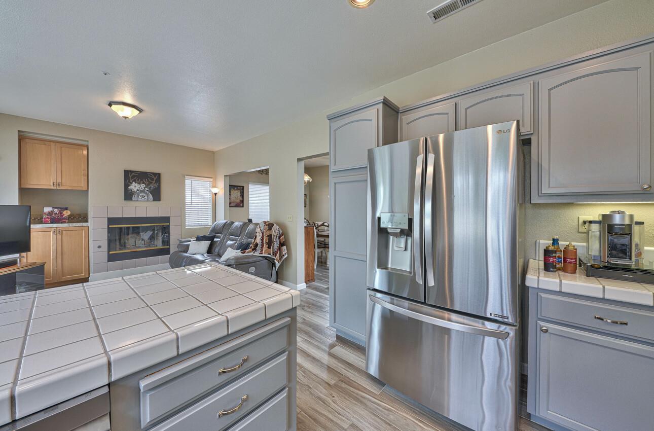 18067 Stonehaven Salinas, CA 93908 - Photo 11 of 33 a kitchen with kitchen island a counter top space stainless steel appliances and cabinets