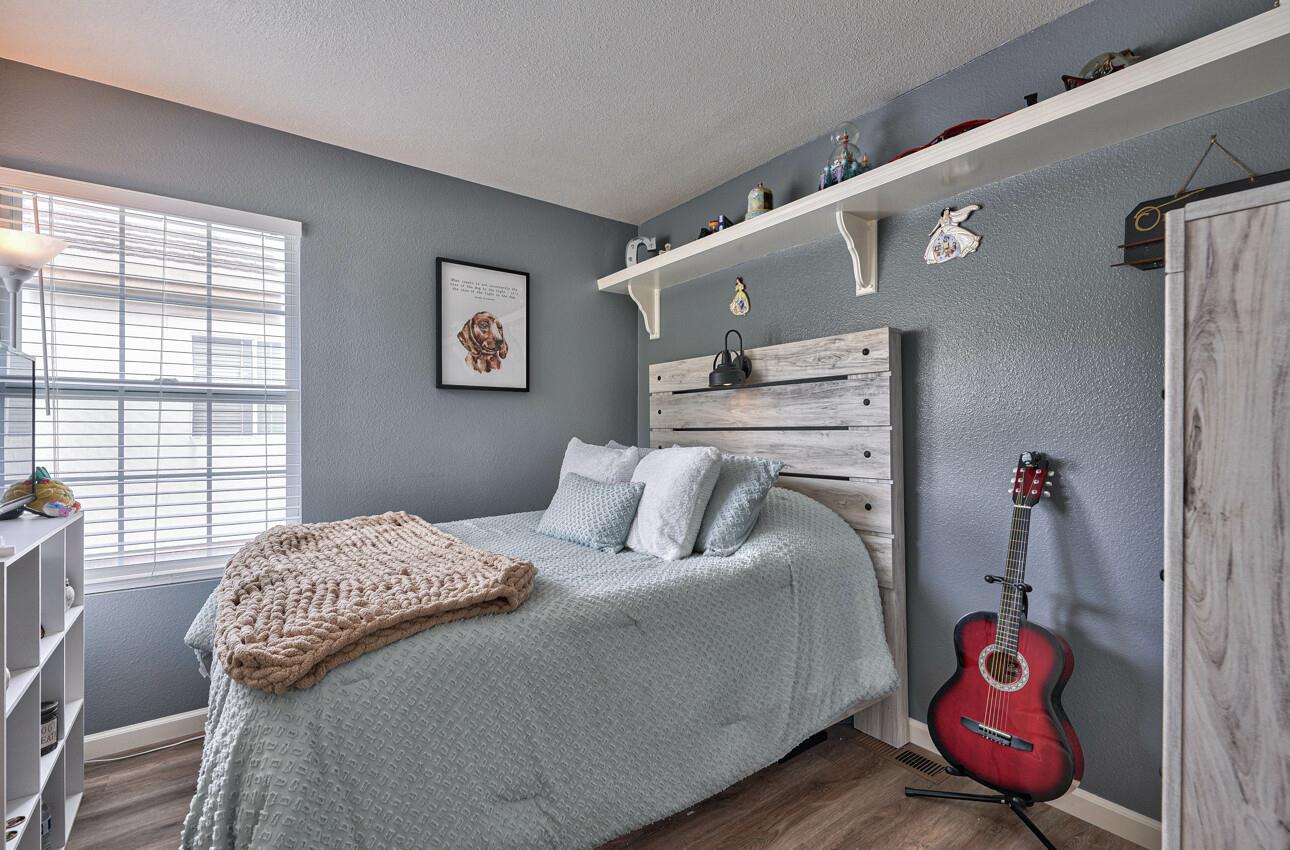 18067 Stonehaven Salinas, CA 93908 - Photo 28 of 33 a bedroom with a bed and wooden floor