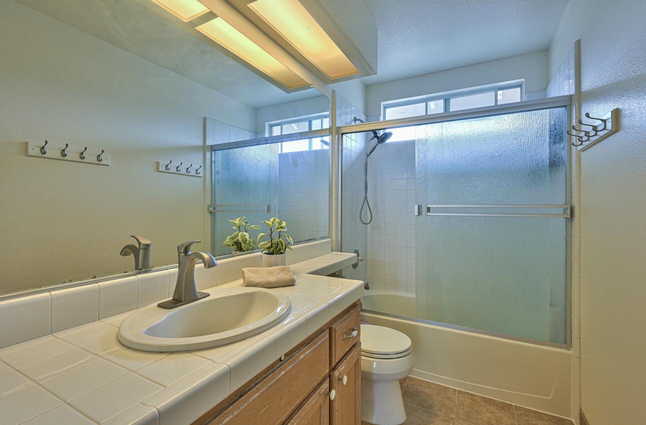 18067 Stonehaven Salinas, CA 93908 - Photo 30 of 33 a bathroom with a sink toilet and shower
