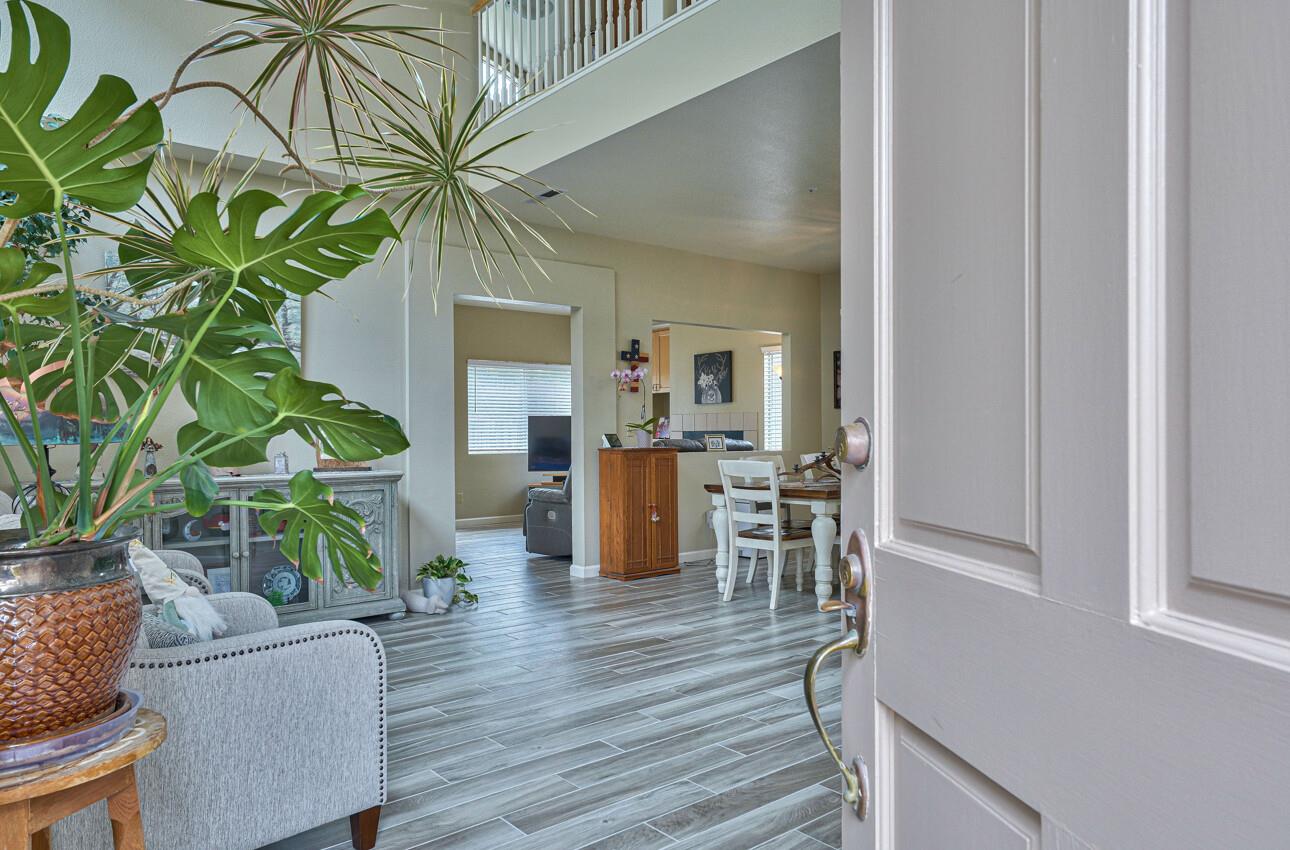 18067 Stonehaven Salinas, CA 93908 - Photo 4 of 33 a living room with furniture and a potted plant