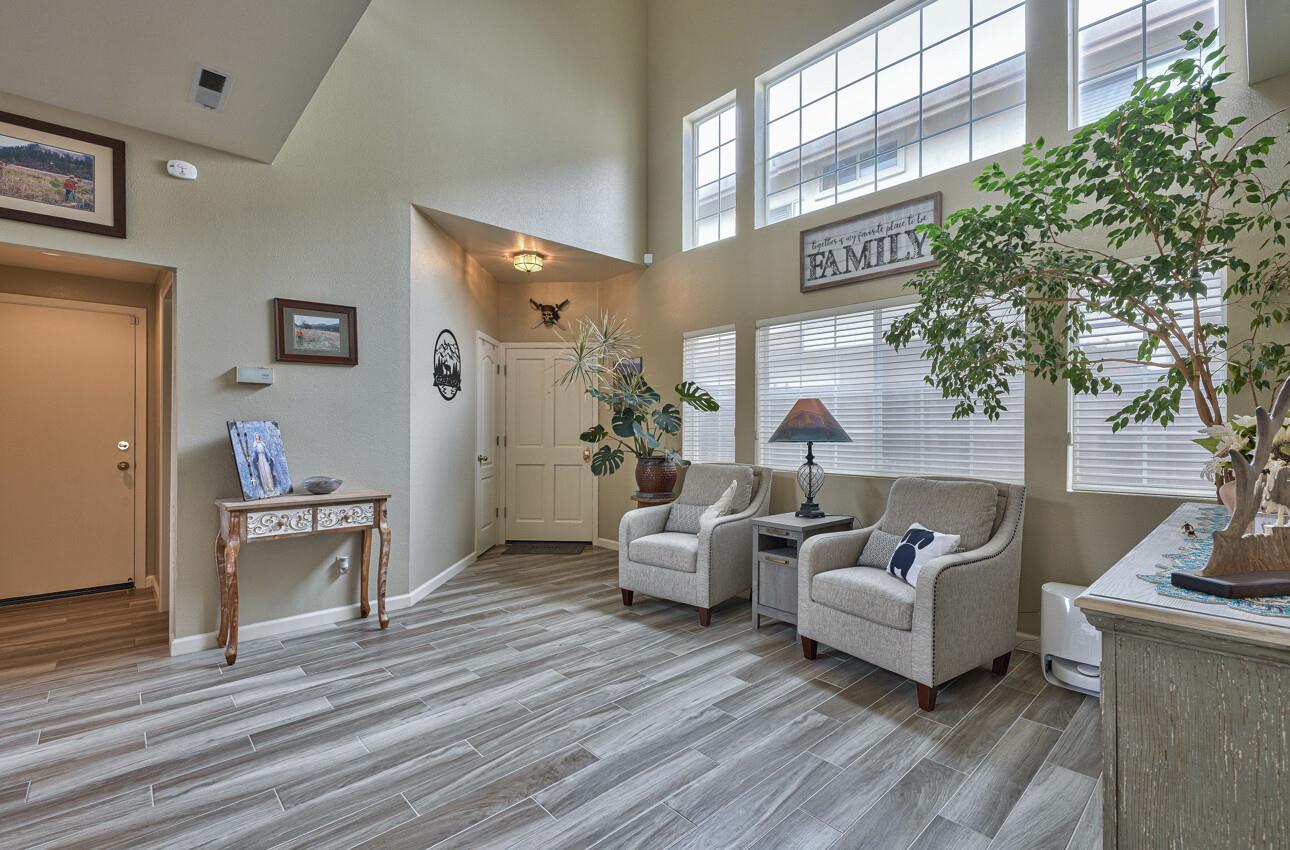 18067 Stonehaven Salinas, CA 93908 - Photo 5 of 33 a living room with furniture and a potted plant