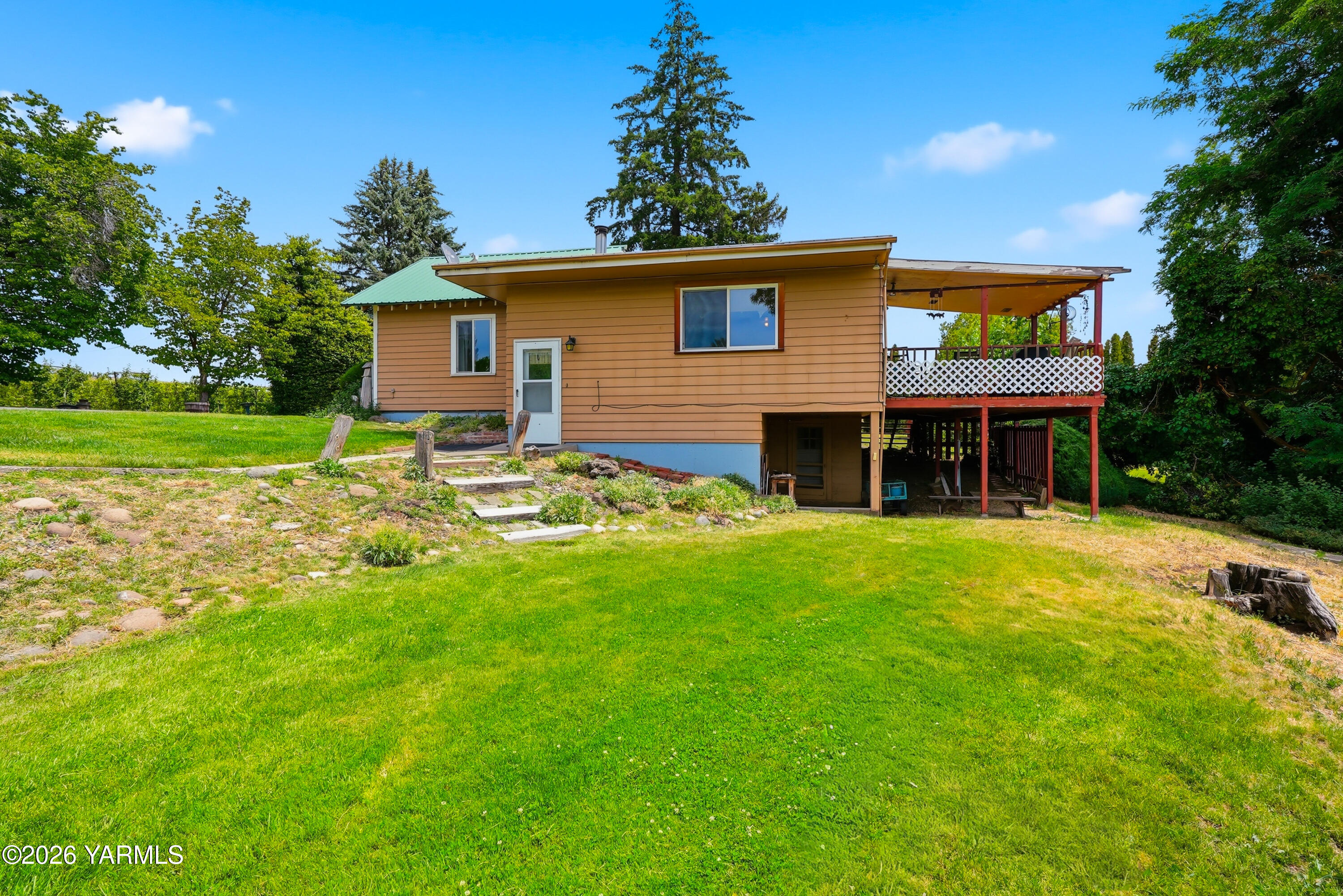 690 North Gleed Road Naches, WA 98937 - Photo 31 of 60 a front view of a house with garden