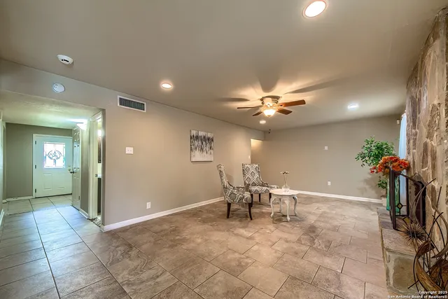a view of a livingroom with a dinning area furniture and a chandelier