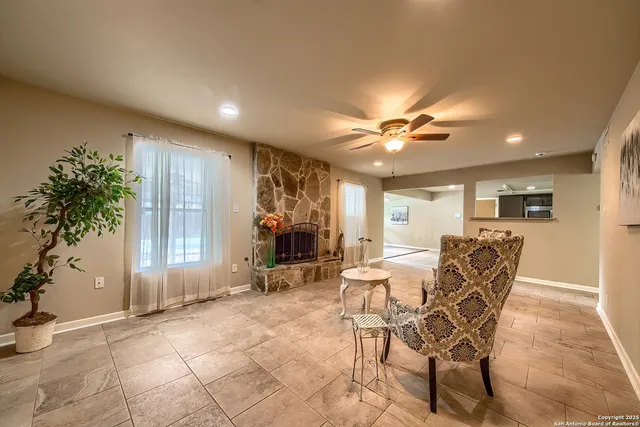 a view of a livingroom with furniture and a potted plant