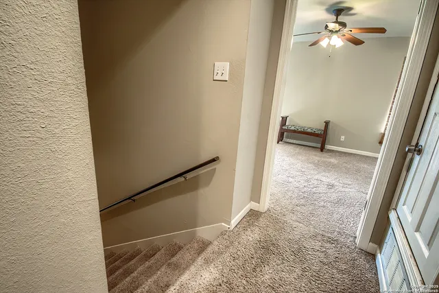 a view of a hallway view with staircase