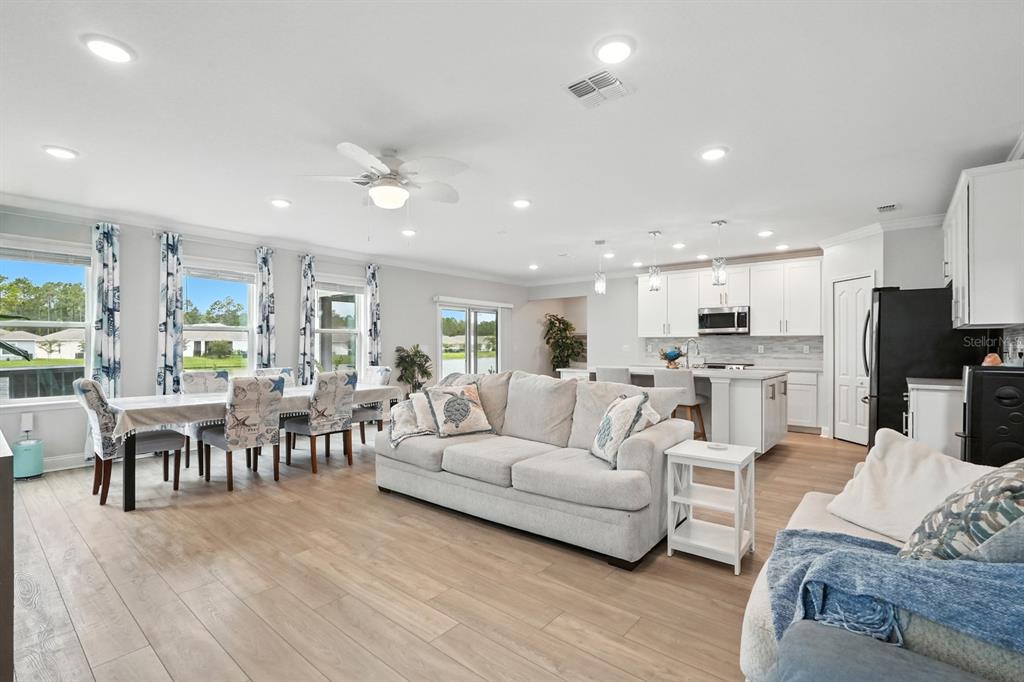 28 Ridge Road Palm Coast, FL 32137 - Photo 14 of 57 a living room with furniture and kitchen view