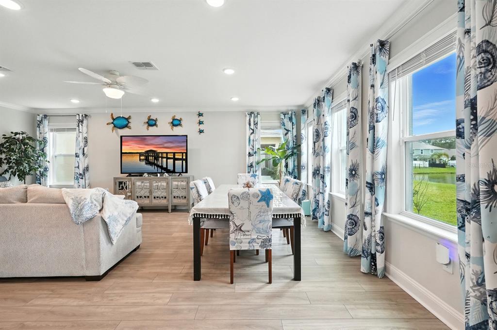 28 Ridge Road Palm Coast, FL 32137 - Photo 16 of 57 a living room with fireplace furniture and a large window