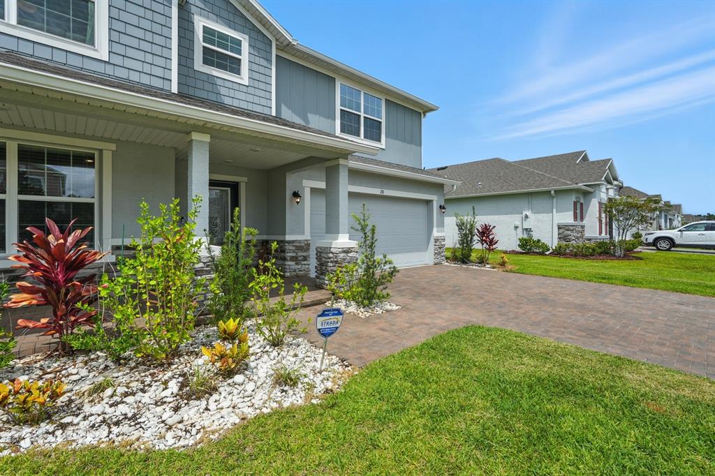 28 Ridge Road Palm Coast, FL 32137 - Photo 50 of 57 a front view of a house with a yard