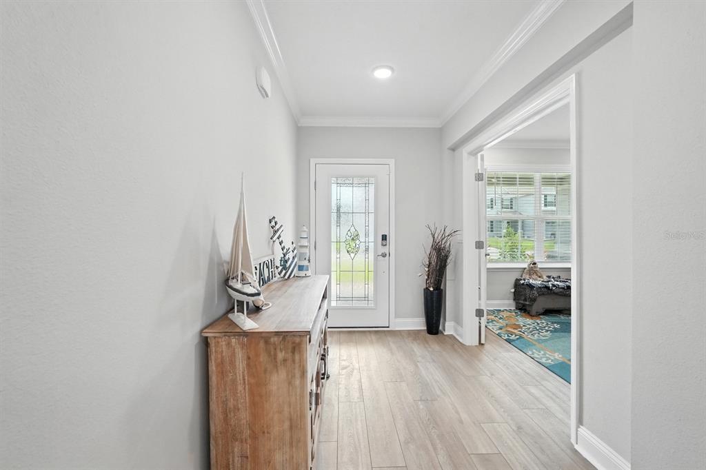 28 Ridge Road Palm Coast, FL 32137 - Photo 5 of 57 a living room with furniture and a large window