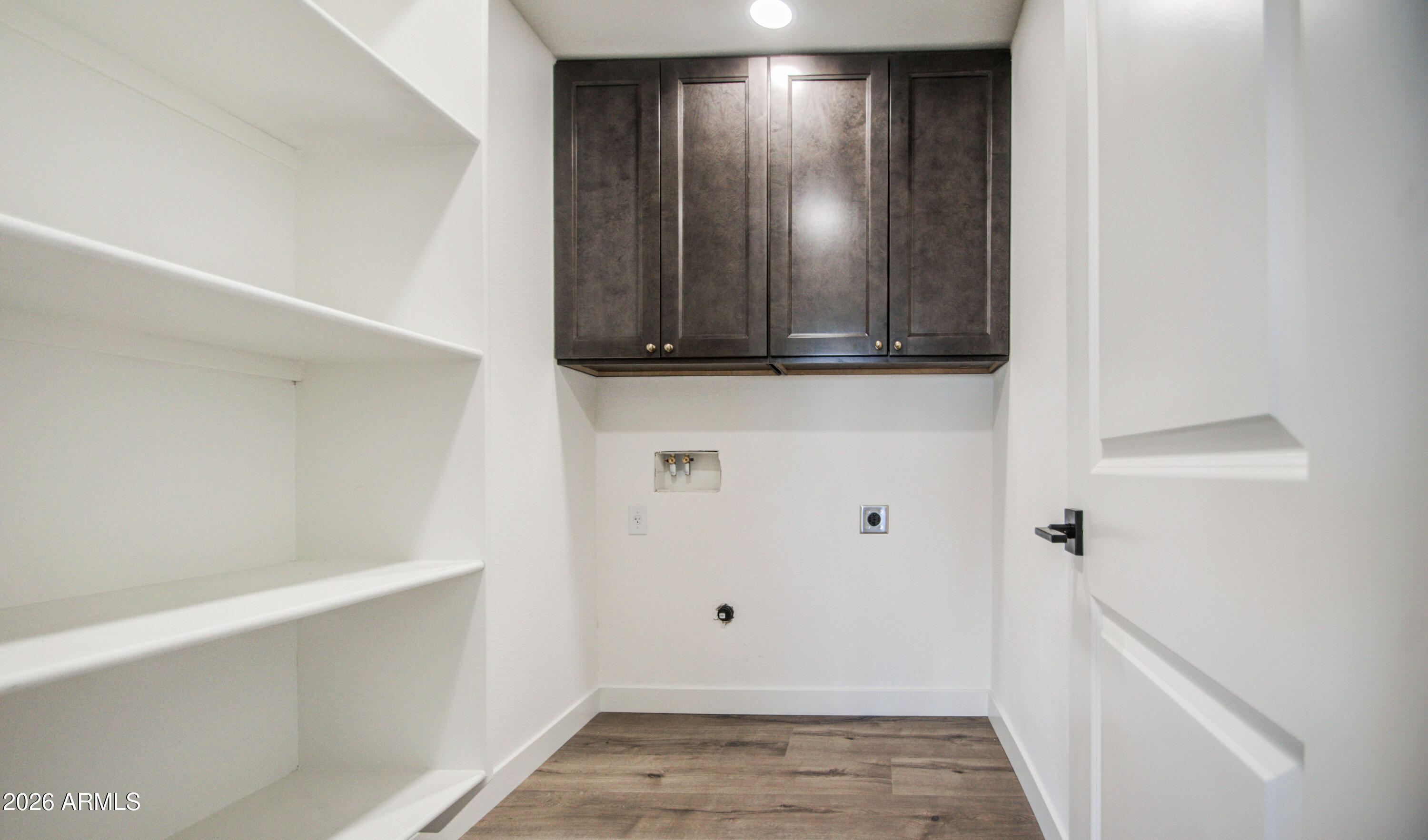 1203 West Elna Rae Street Tempe, AZ 85281 - Photo 21 of 34 a view of a hallway with wooden floor