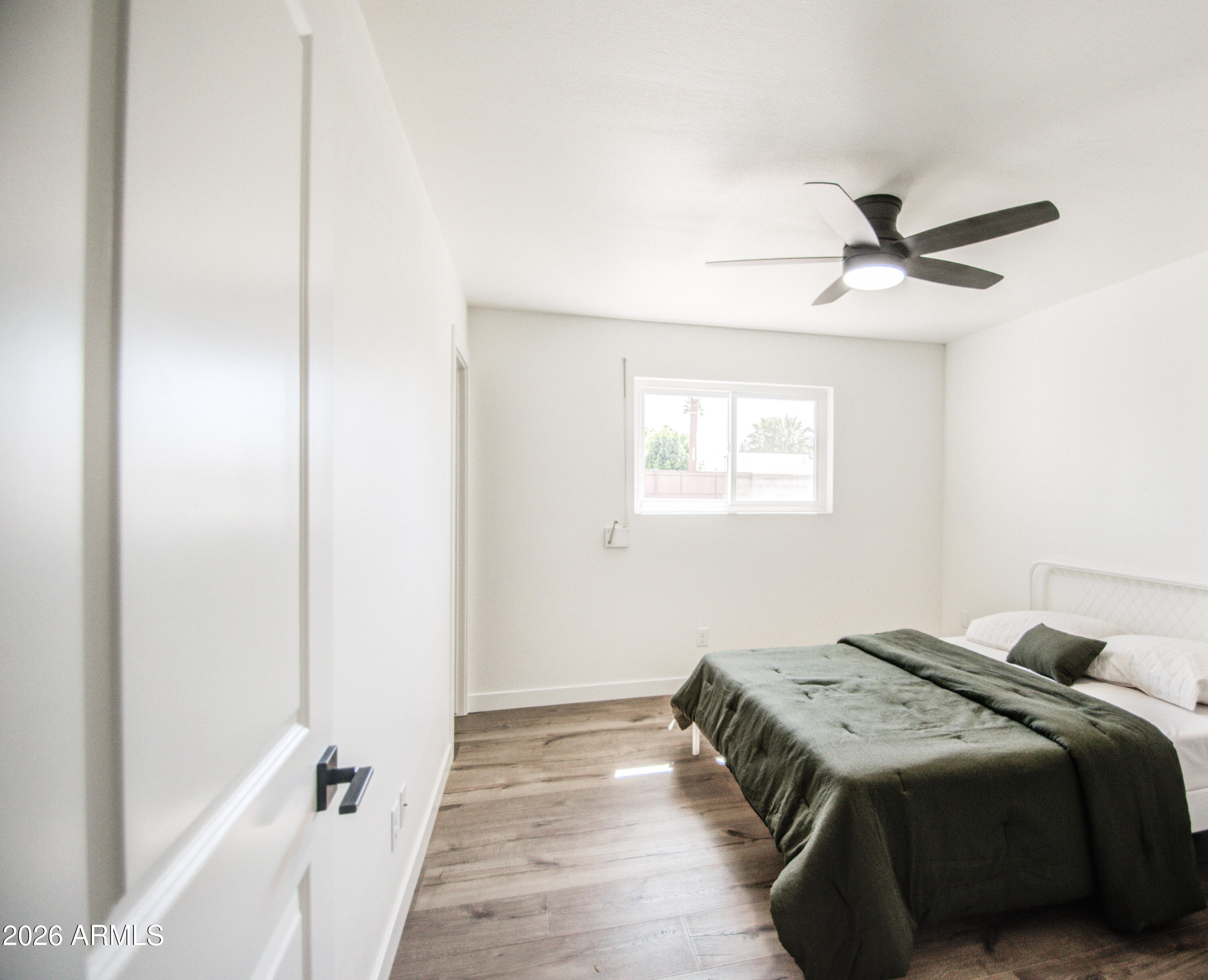 1203 West Elna Rae Street Tempe, AZ 85281 - Photo 24 of 34 a bedroom with a bed and a window