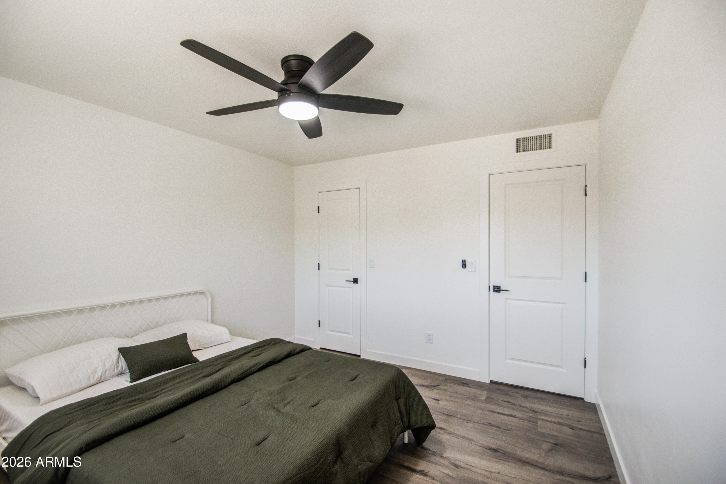 1203 West Elna Rae Street Tempe, AZ 85281 - Photo 25 of 34 a bedroom with a bed and a ceiling fan
