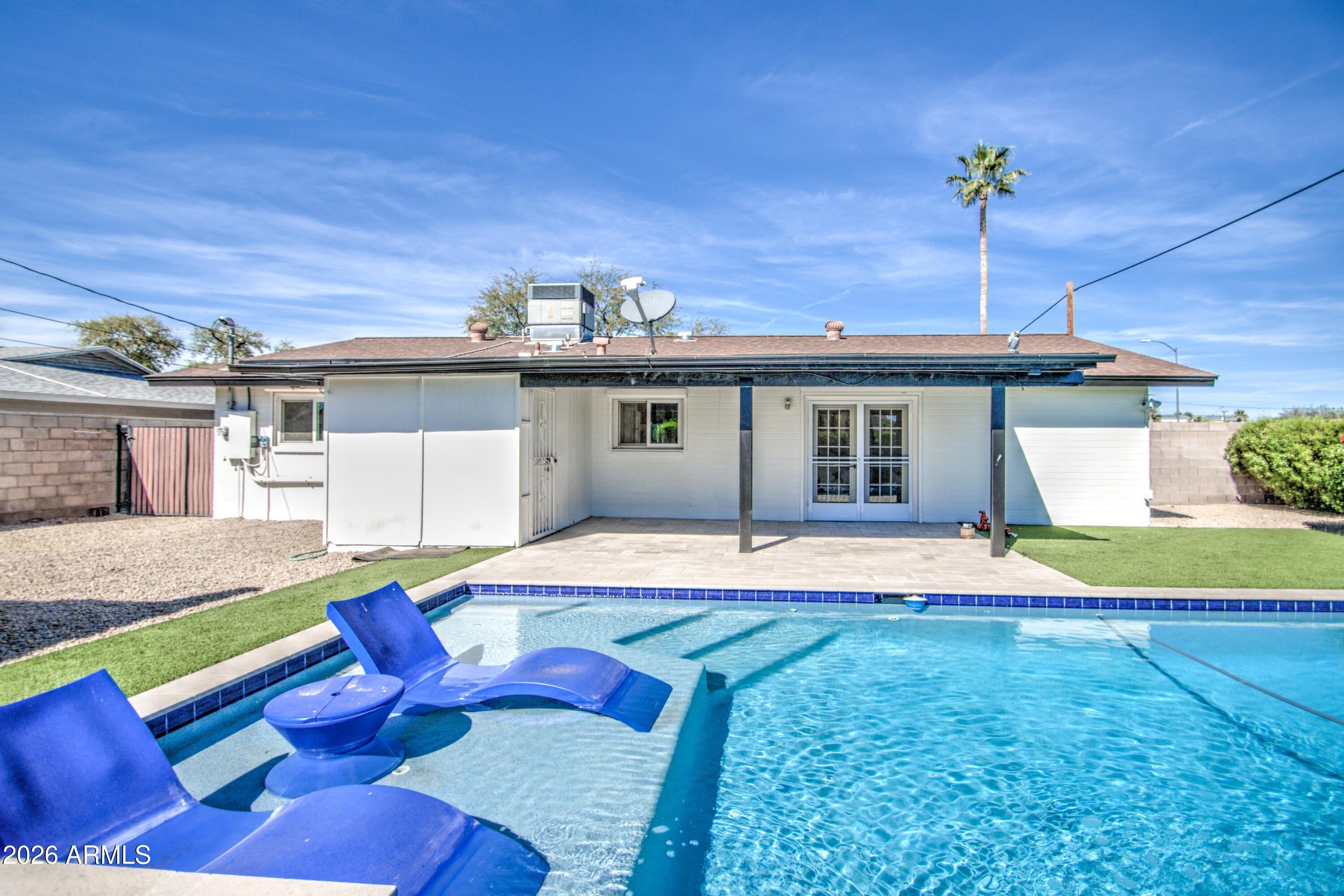 1203 West Elna Rae Street Tempe, AZ 85281 - Photo 32 of 34 a view of a house with swimming pool and porch