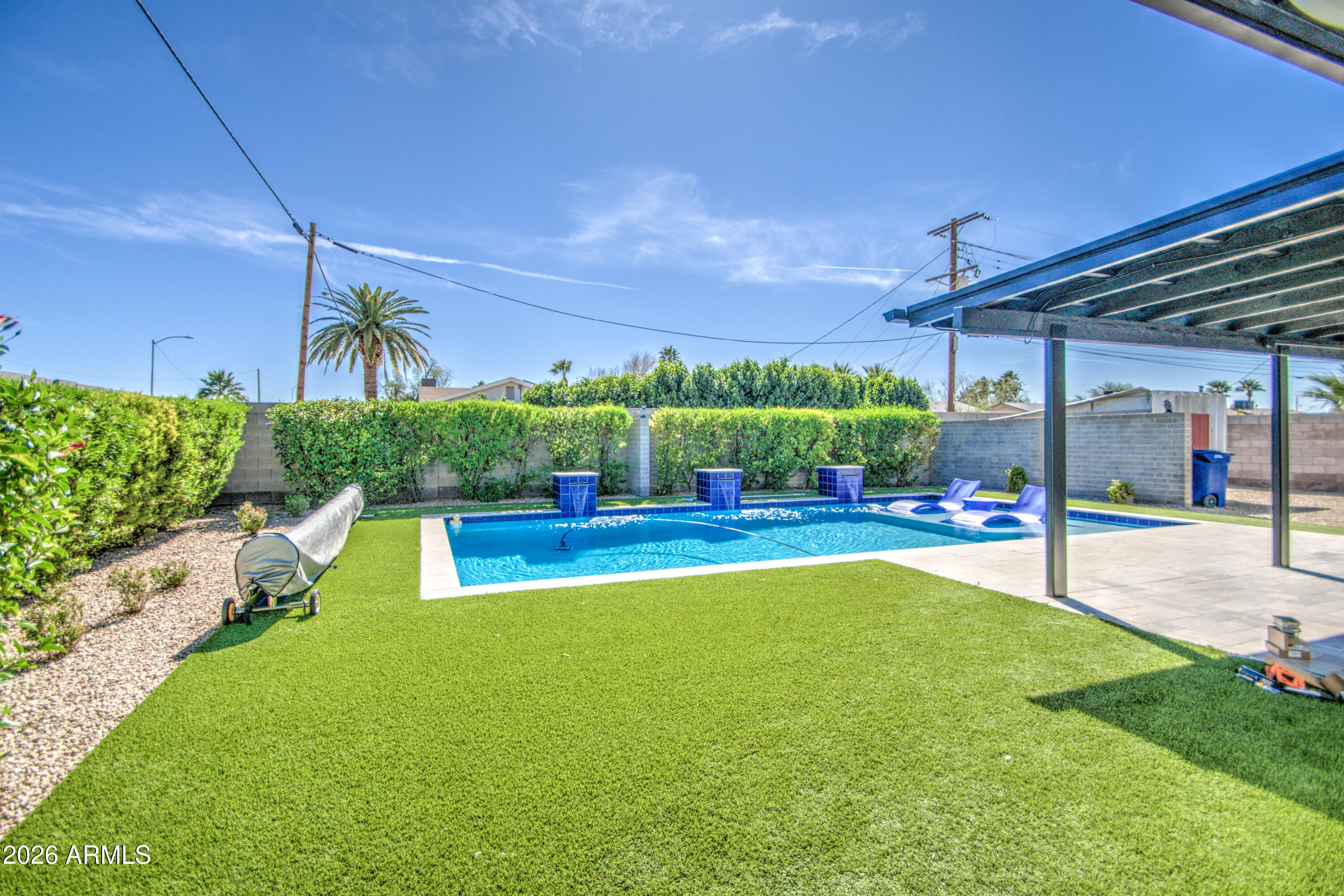1203 West Elna Rae Street Tempe, AZ 85281 - Photo 34 of 34 a view of a swimming pool with a patio