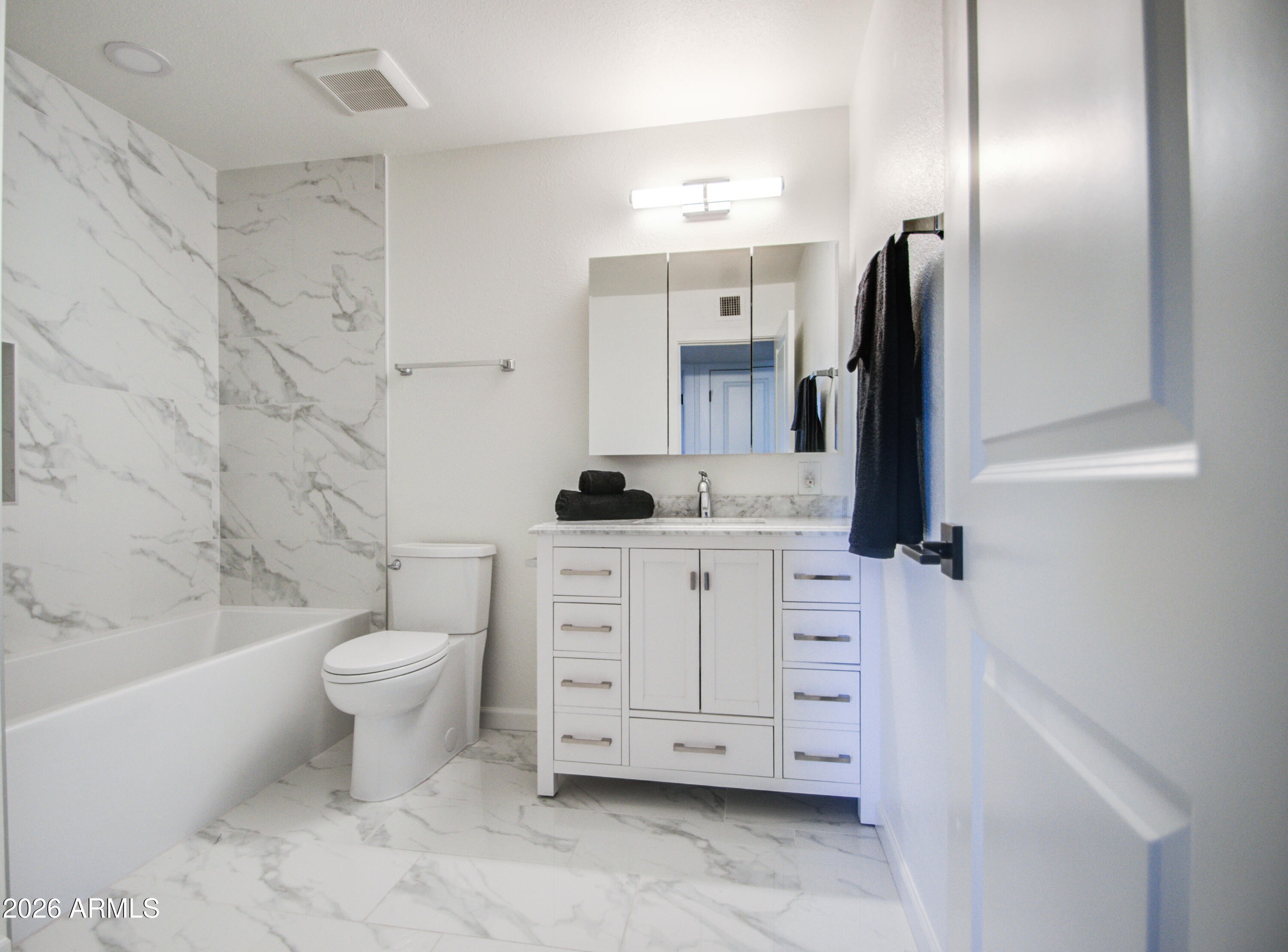 1203 West Elna Rae Street Tempe, AZ 85281 - Photo 4 of 34 a bathroom with a double vanity sink toilet and shower