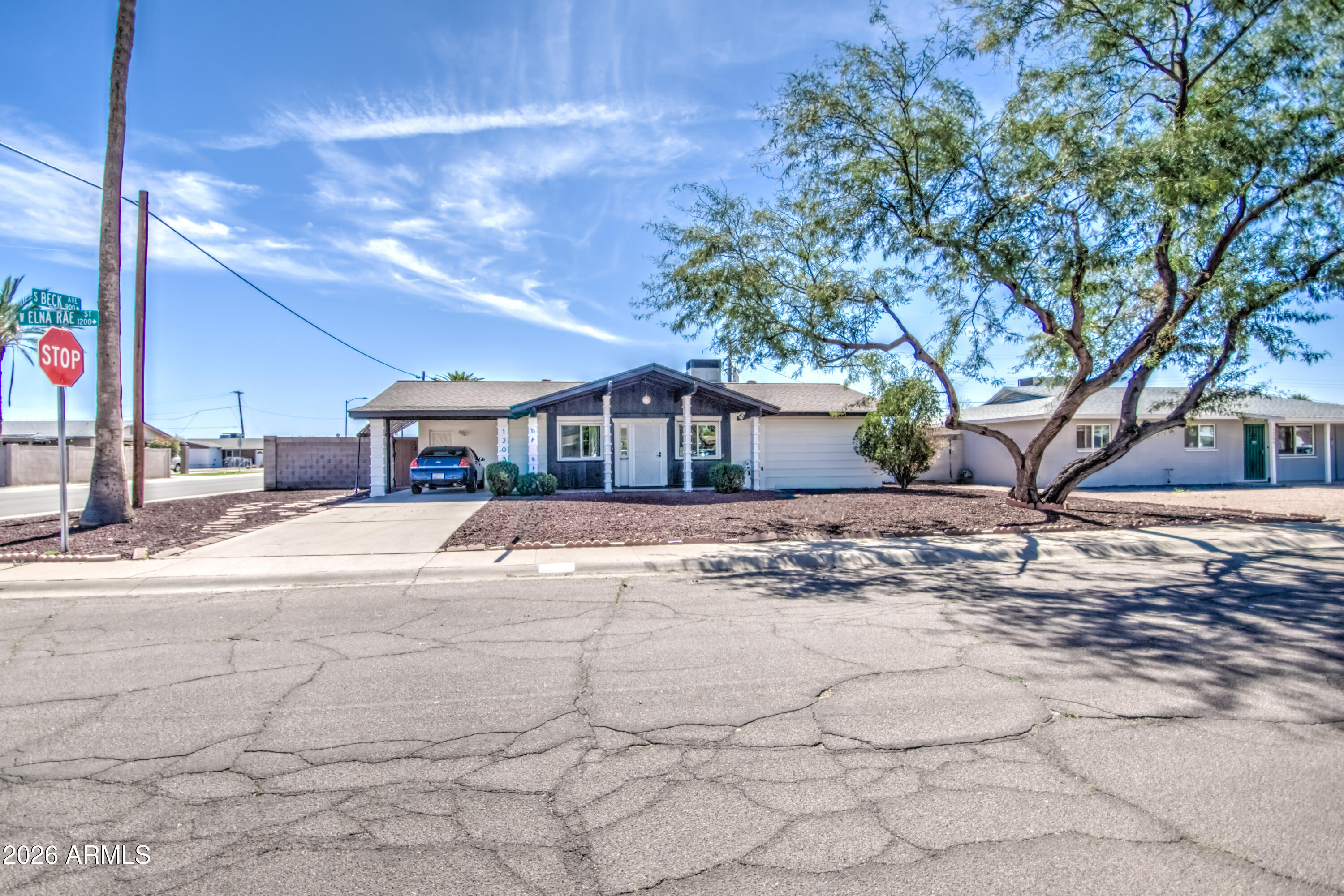 1203 West Elna Rae Street Tempe, AZ 85281 - Photo 5 of 34 a front view of a house with a yard