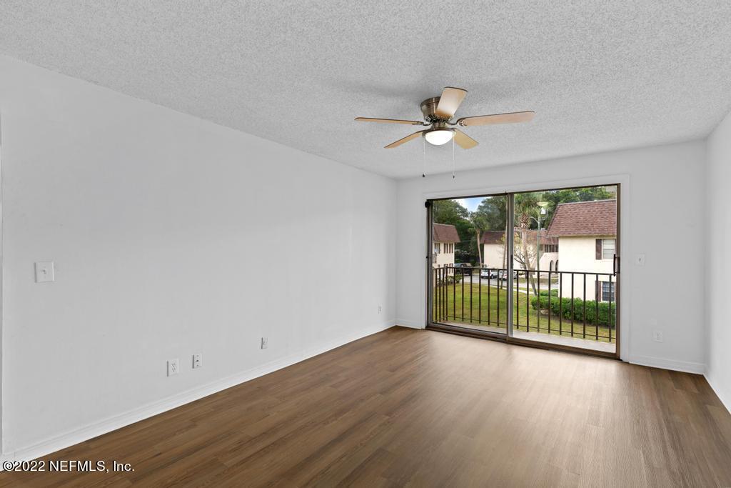 1647 El Camino Road, Unit 5 Jacksonville, FL 32216 - Photo 11 of 44 wooden floor in an empty room with a window