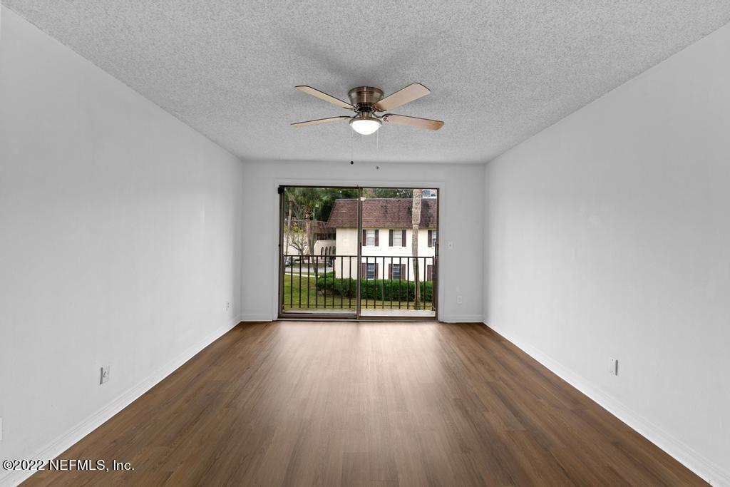 1647 El Camino Road, Unit 5 Jacksonville, FL 32216 - Photo 12 of 44 wooden floor in an empty room with a window