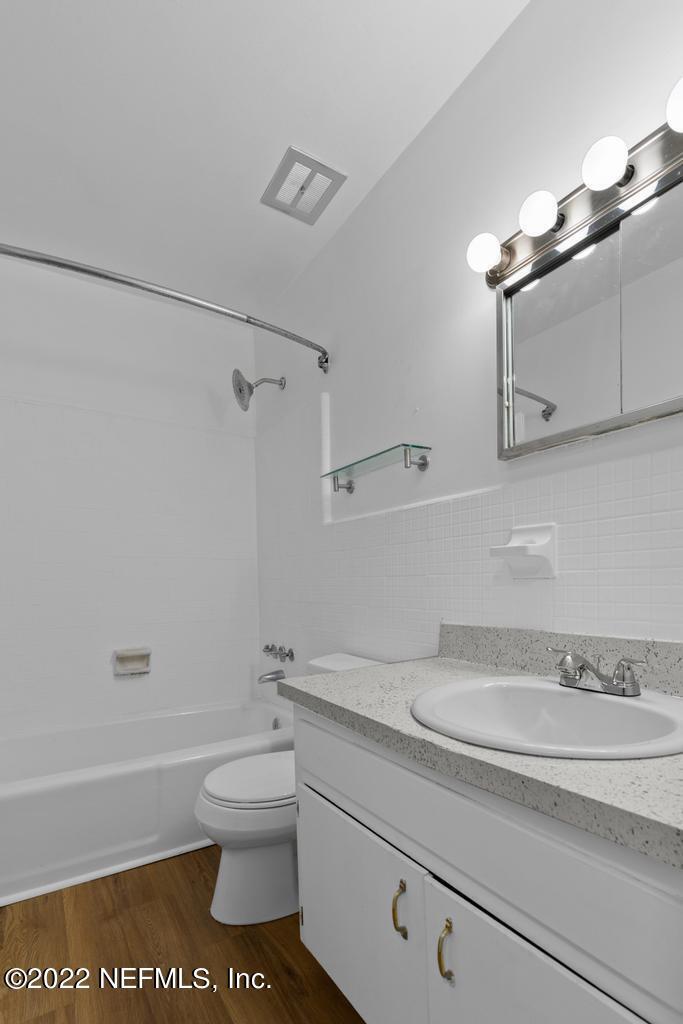1647 El Camino Road, Unit 5 Jacksonville, FL 32216 - Photo 21 of 44 a bathroom with a sink a toilet and shower