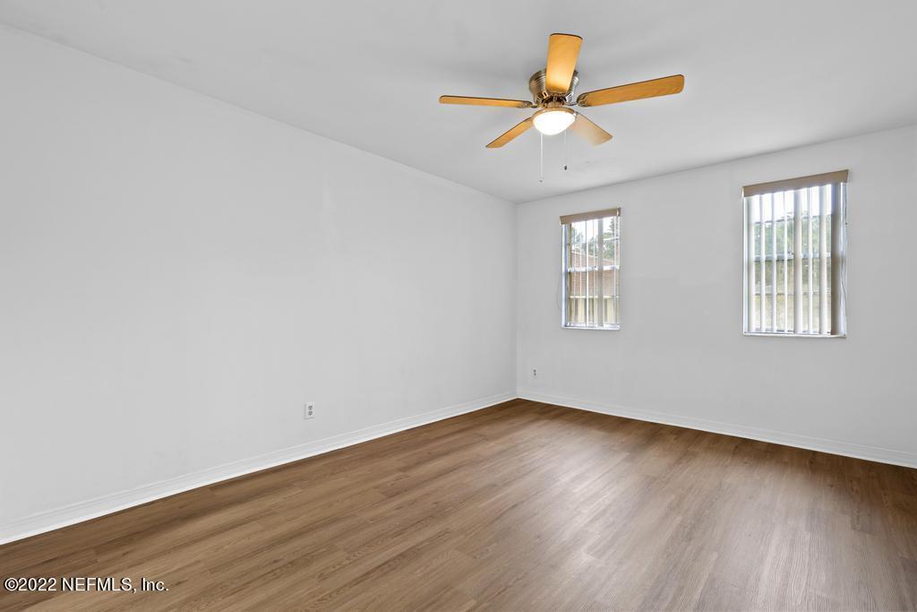 1647 El Camino Road, Unit 5 Jacksonville, FL 32216 - Photo 22 of 44 wooden floor in an empty room with a window