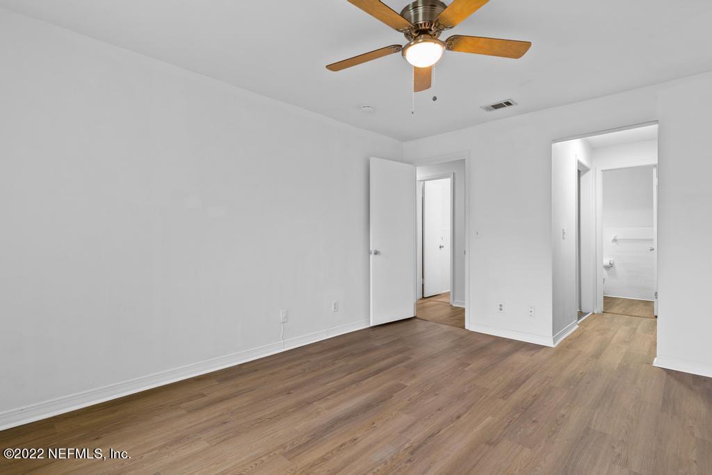 1647 El Camino Road, Unit 5 Jacksonville, FL 32216 - Photo 24 of 44 an empty room with wooden floor fan and windows