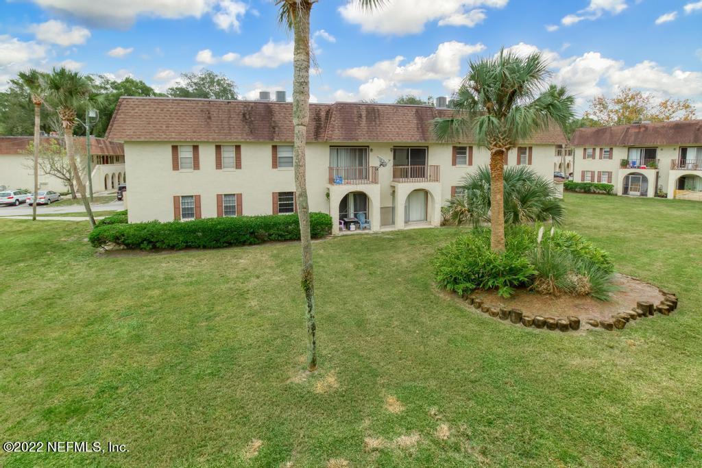 1647 El Camino Road, Unit 5 Jacksonville, FL 32216 - Photo 31 of 44 a front view of a house with garden
