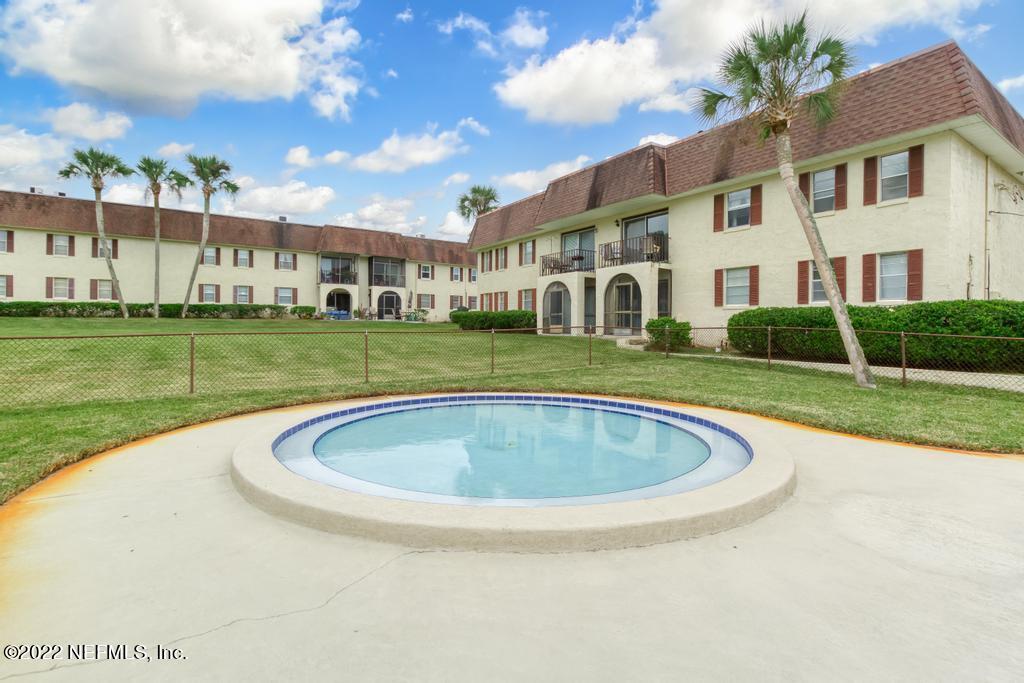 1647 El Camino Road, Unit 5 Jacksonville, FL 32216 - Photo 37 of 44 a view of a house with a swimming pool