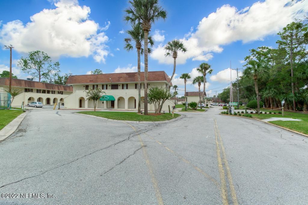 1647 El Camino Road, Unit 5 Jacksonville, FL 32216 - Photo 42 of 44 a group of cars parked in front of building
