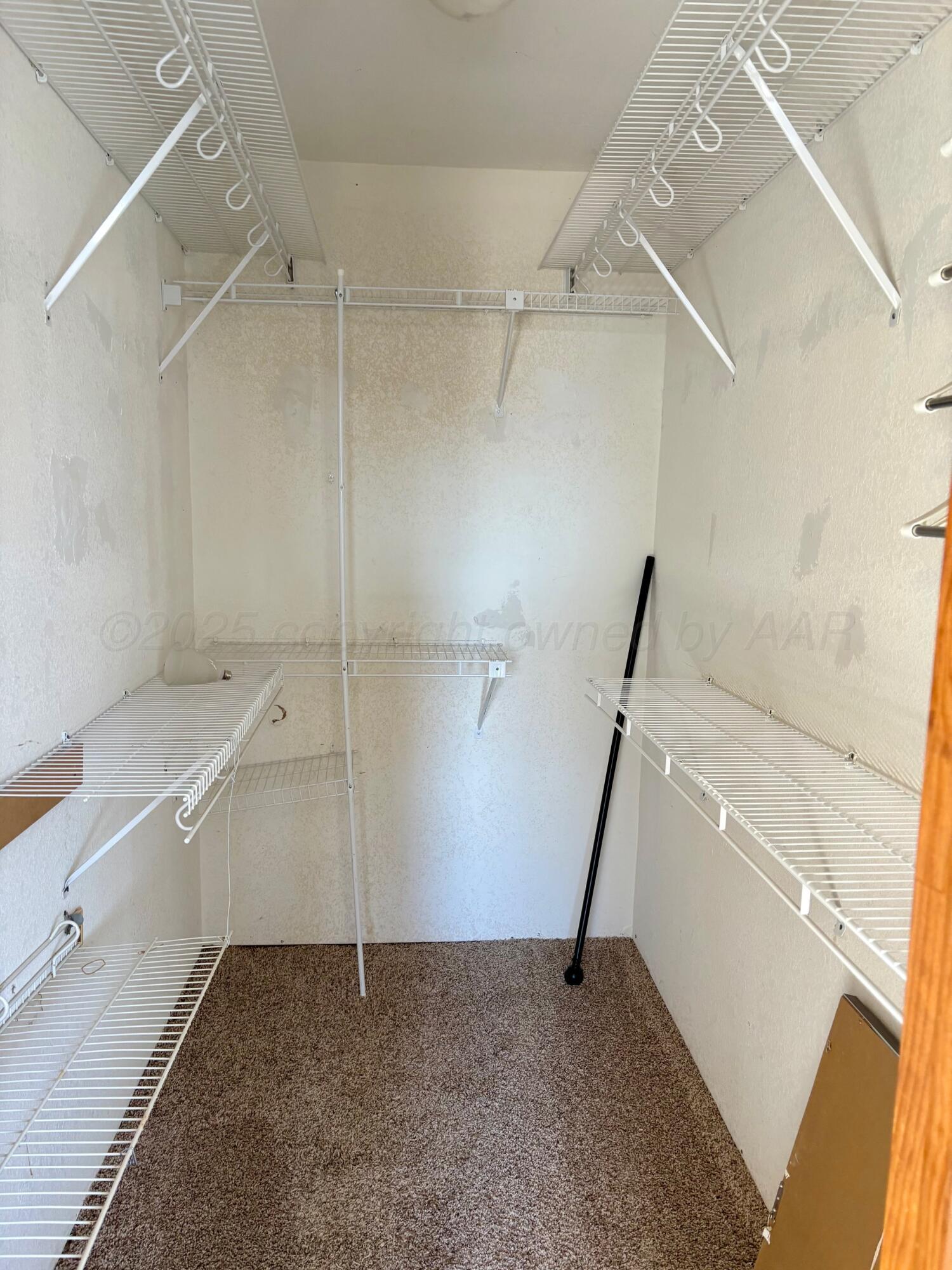 1114 Parr Street Amarillo, TX 79106 - Photo 14 of 28 a view of a room with racks on the wall