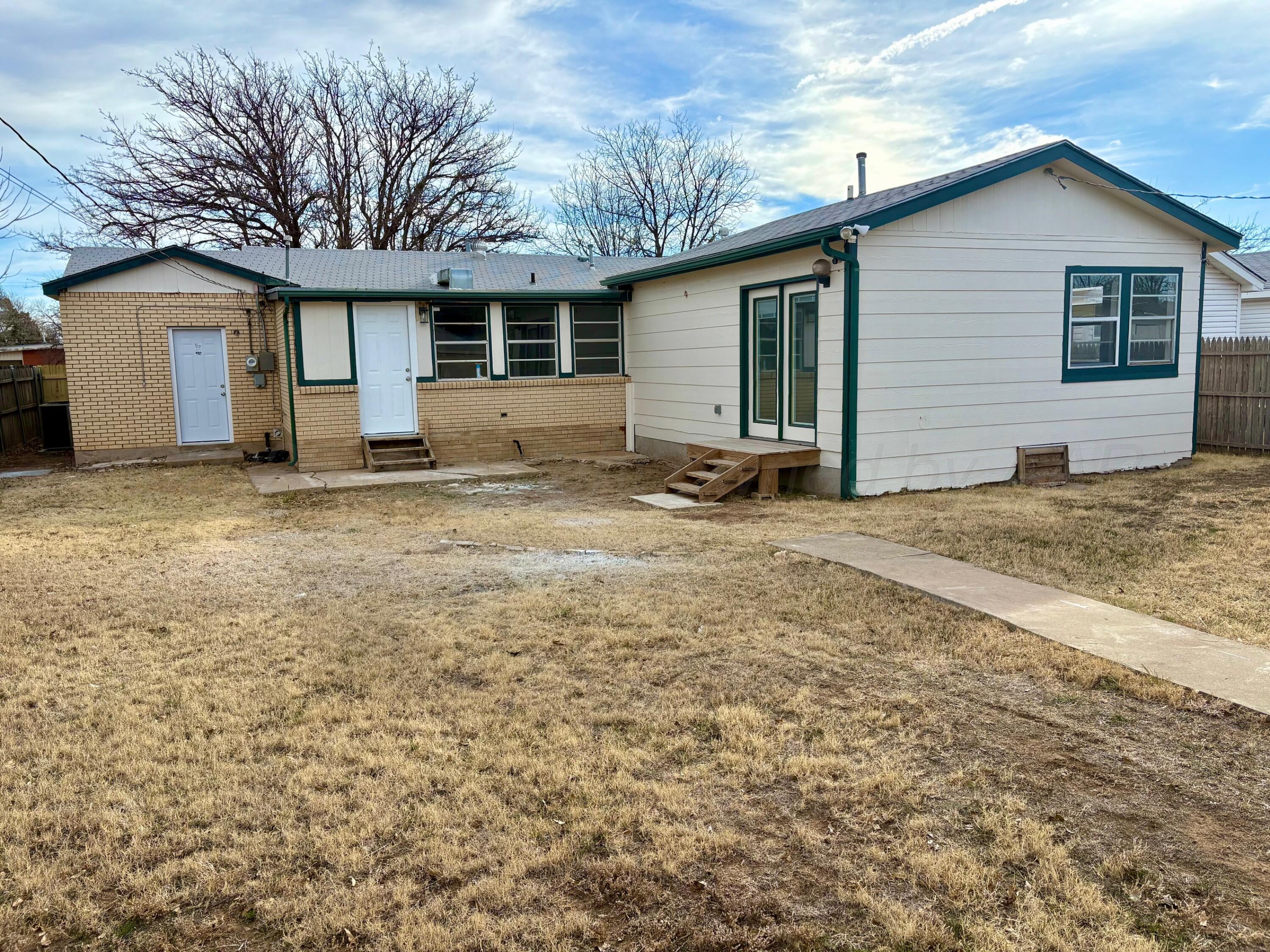 1114 Parr Street Amarillo, TX 79106 - Photo 3 of 28 a view of a house with a backyard