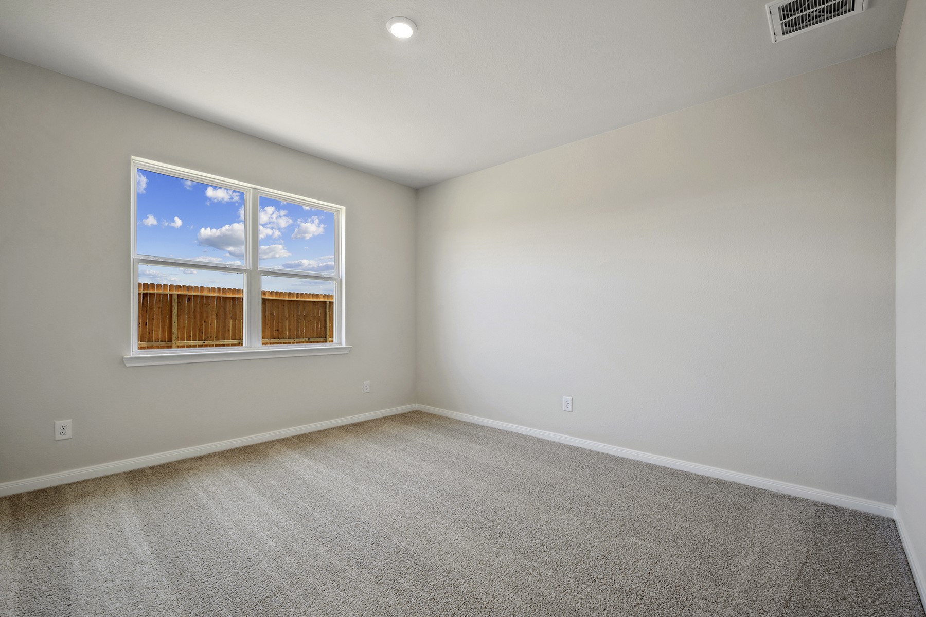 10338 Red Cardinal Drive Cleveland, TX 77328 - Photo 12 of 25 an empty room with a window
